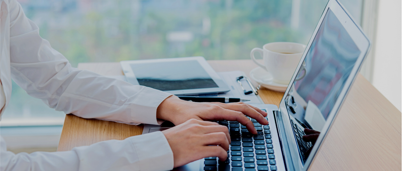 Practitioner typing on a laptop - Preparing for Engaging in Child Protection Conferences - Leeds Safeguarding Children Partnership