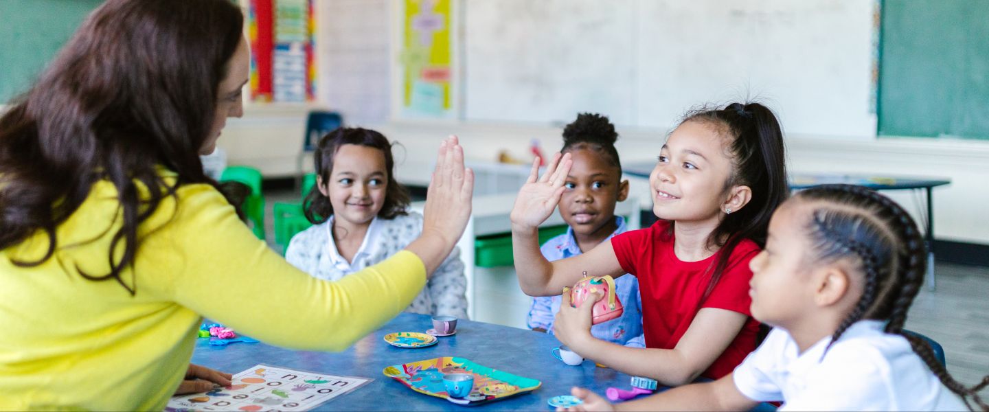 Teacher with school children in a class room