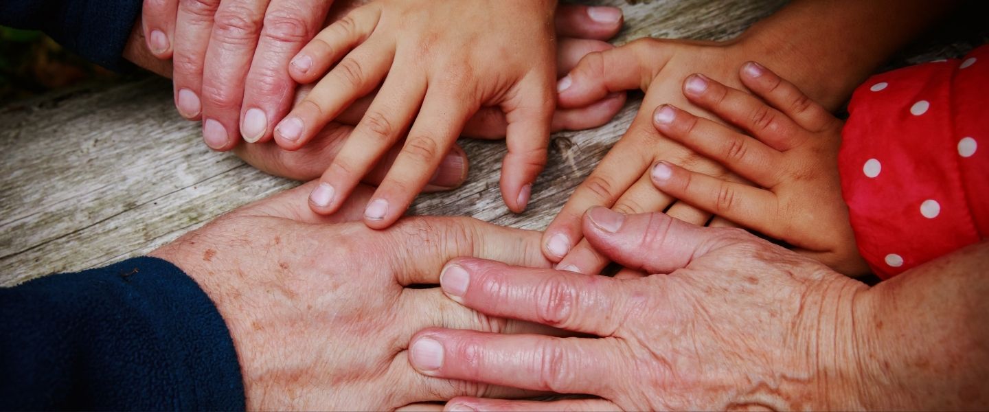 5 hands touching
